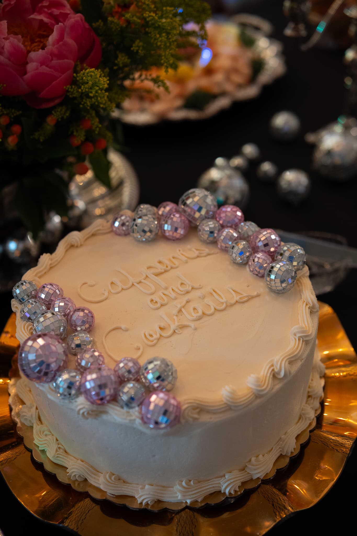 Disco ball cake reading Calpenia and Cocktails