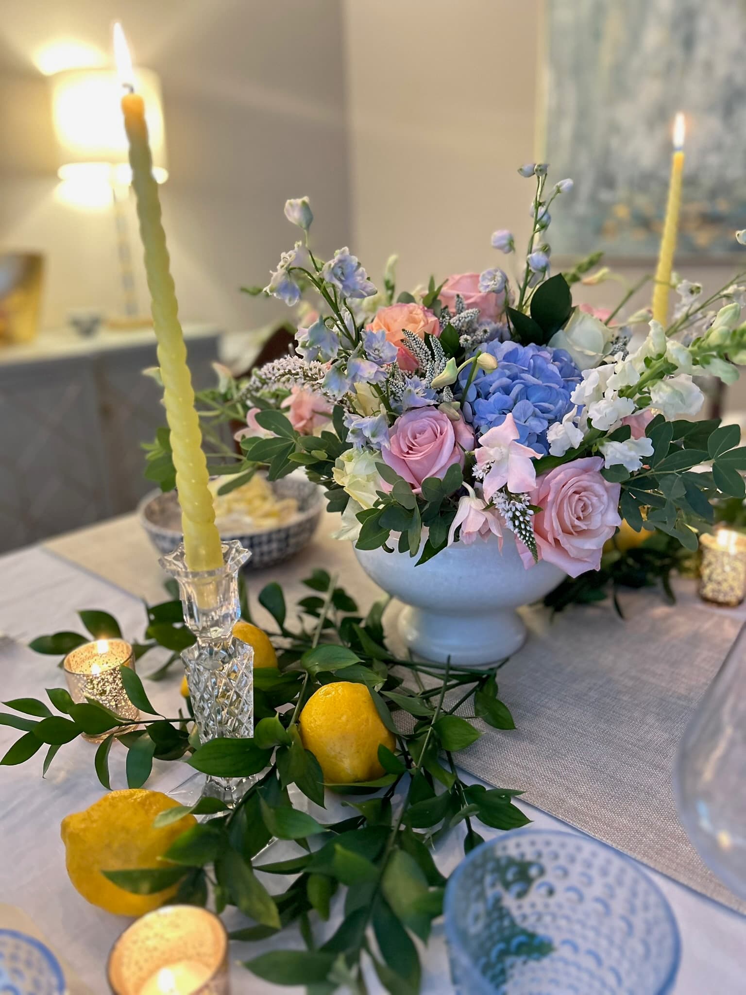 Blue and white centerpiece with lemons and tapers